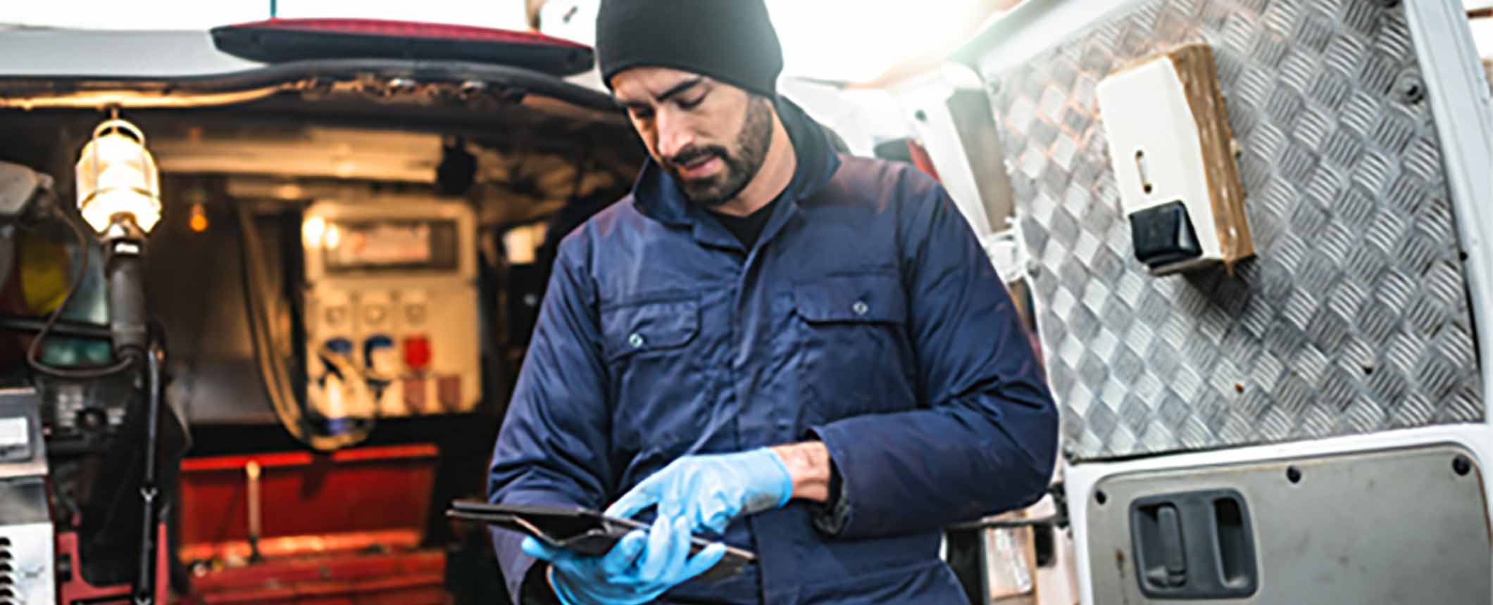 Preventive maintenance mechanic working on fleet vehicles